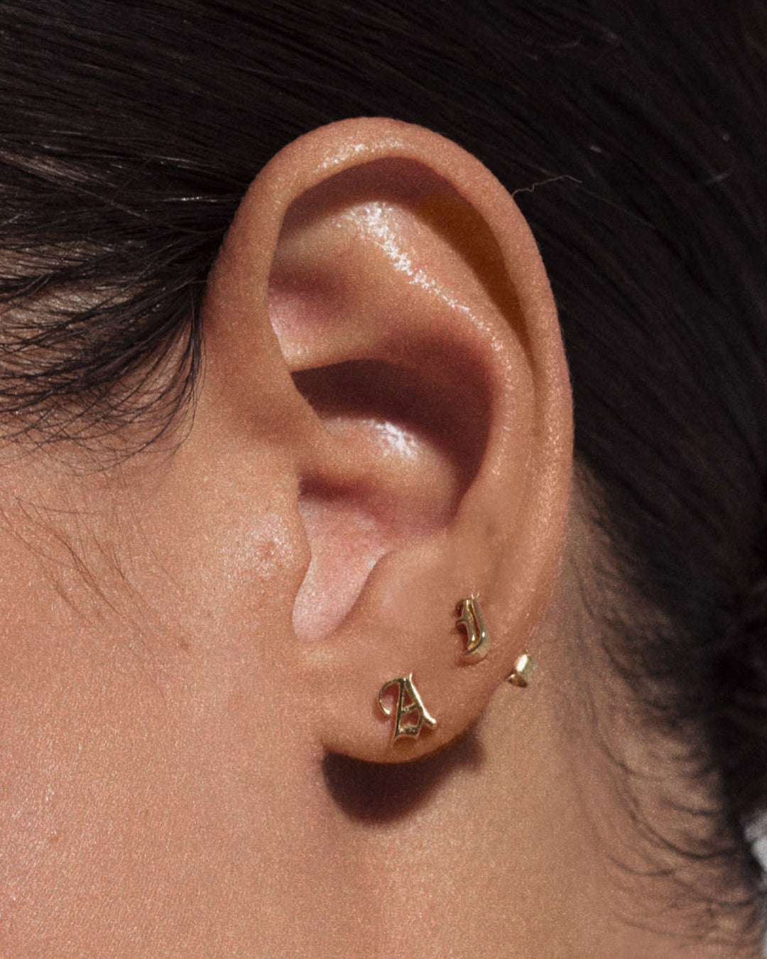 Initial Stud Earrings [Old English] — detail view
