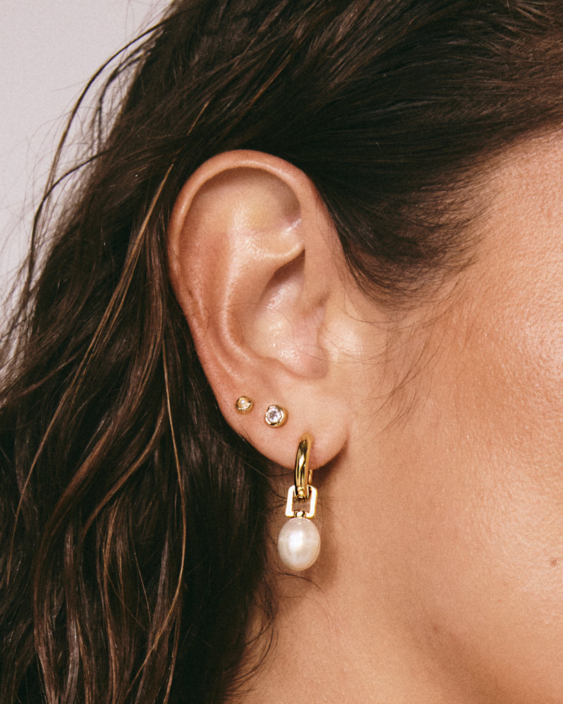White Pearl Amalfi Huggies - Earrings — alternate angle