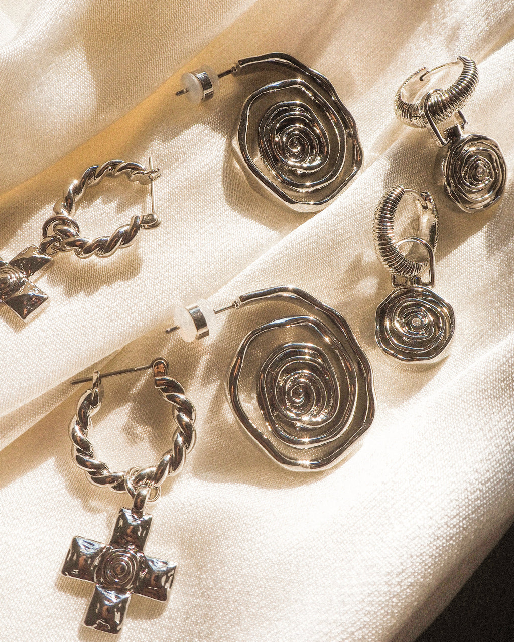 Molten Cross Twisted Hoops - Silver — another angle