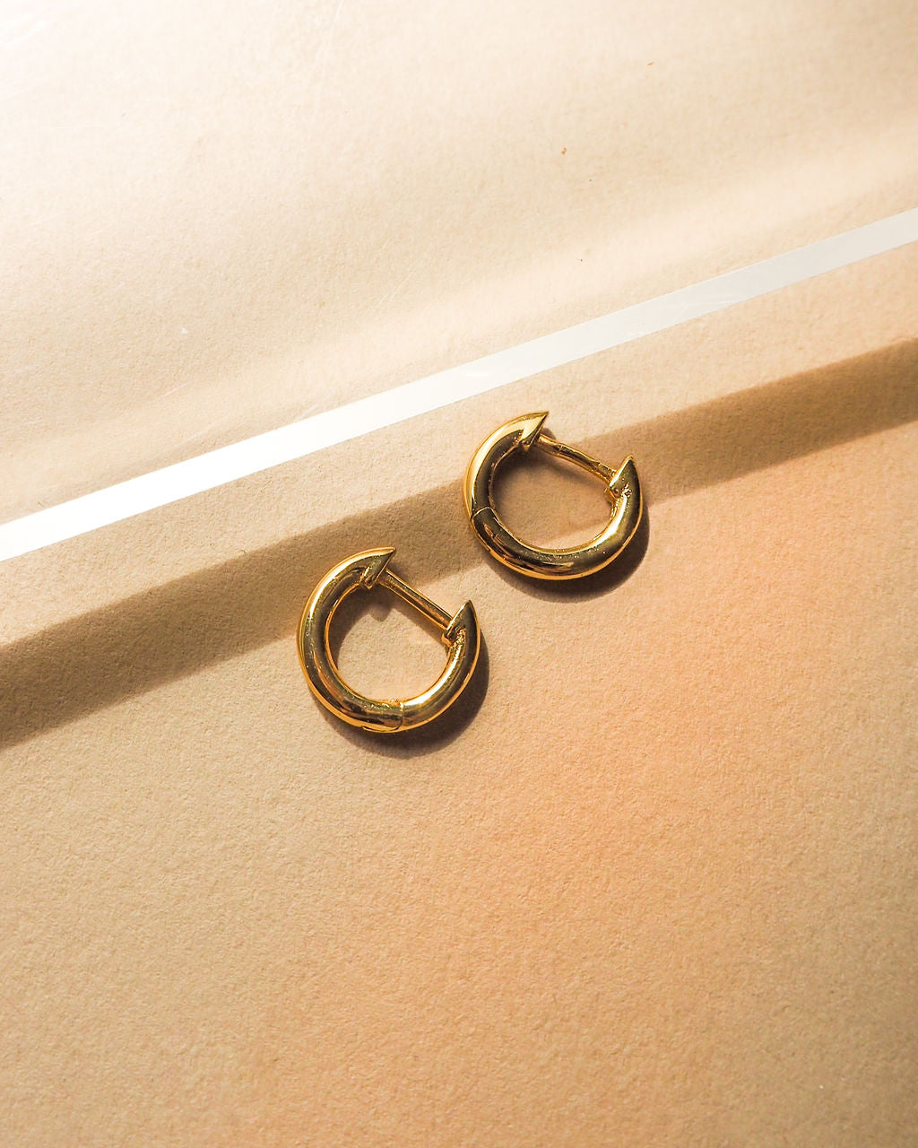 Sicily Huggies - Gold - Earrings — another angle