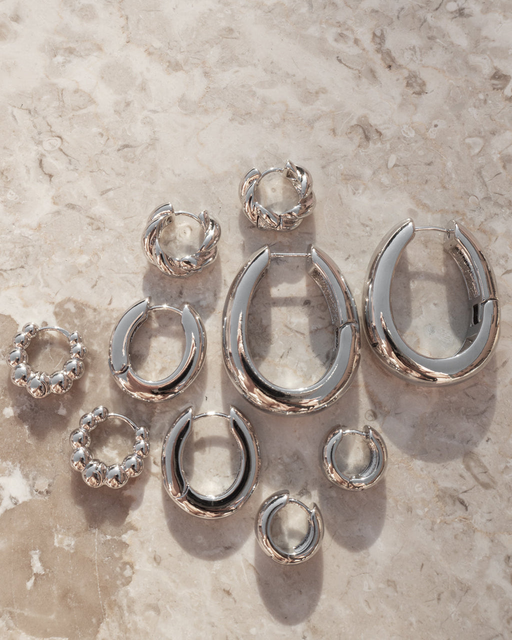 Carmella Huggies (20mm) - Silver - Earrings — detail view