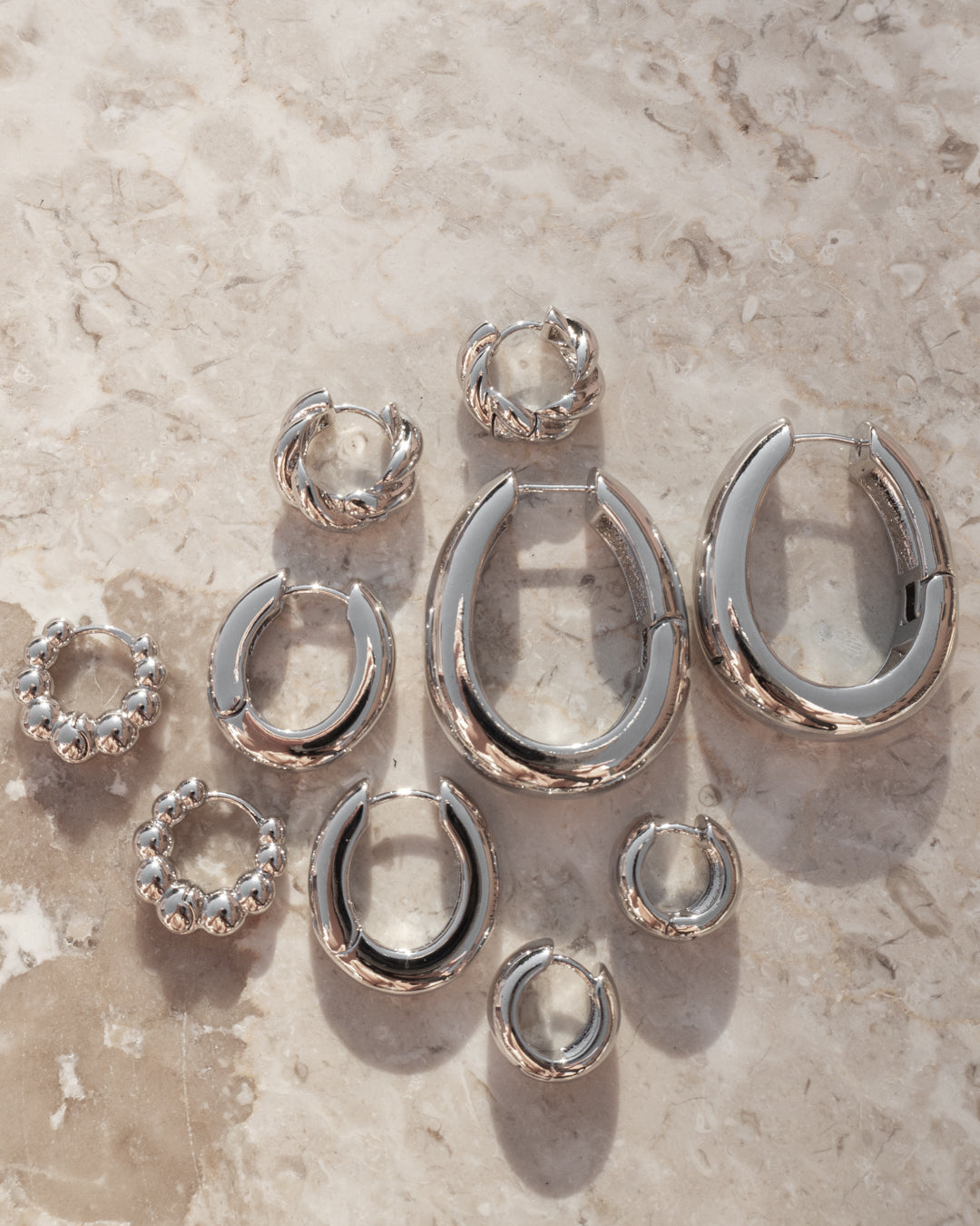 Carmella Huggies (20mm) - Silver - Earrings — detail view