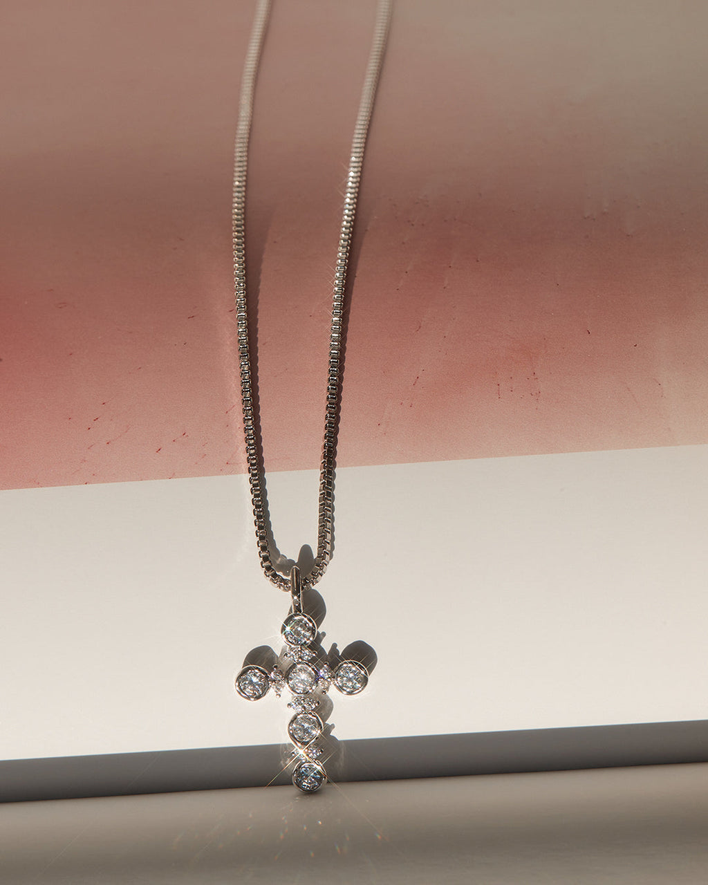 Rosette Cross Charm Necklace in Rose Gold — another angle