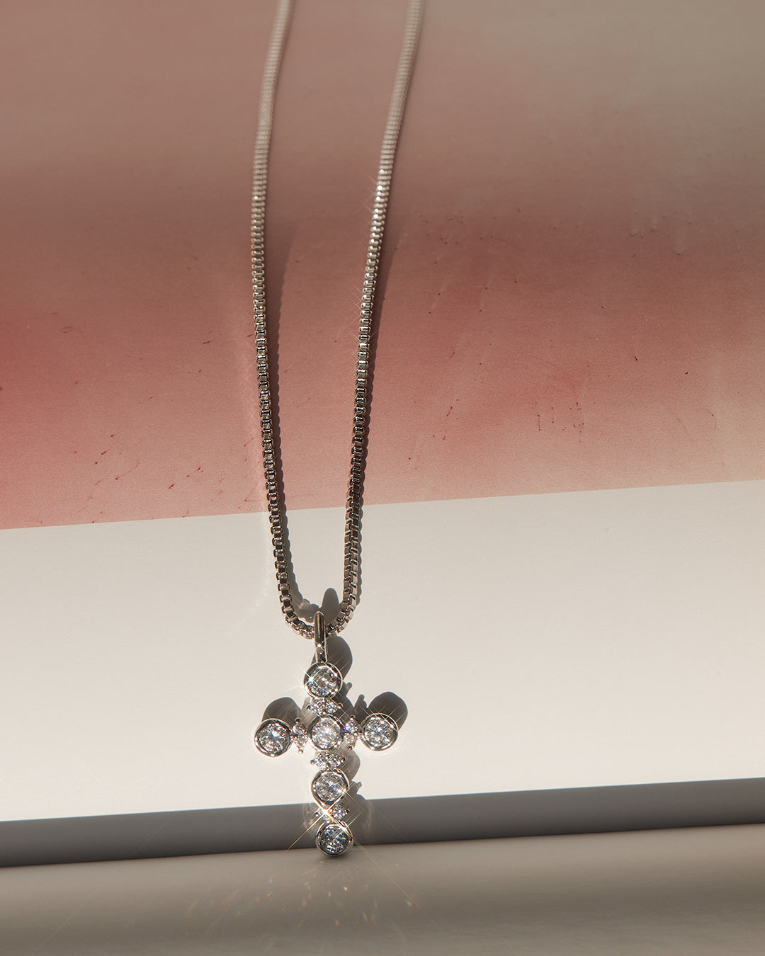 Rosette Cross Charm Necklace in Rose Gold — another angle