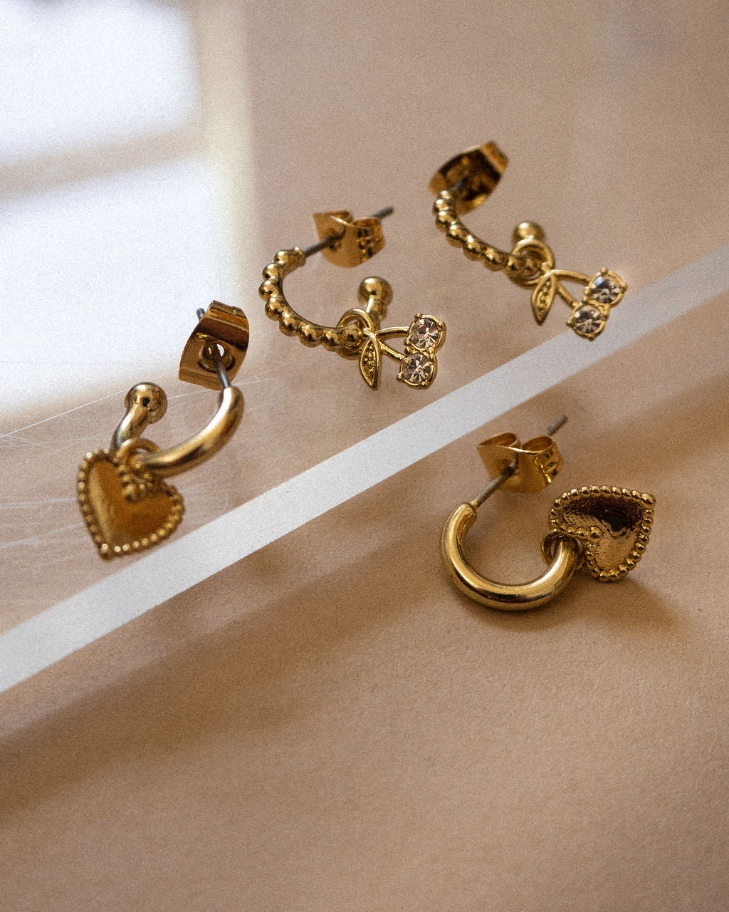 Cherry + Heart Studded Huggies - Gold - Earrings — another angle