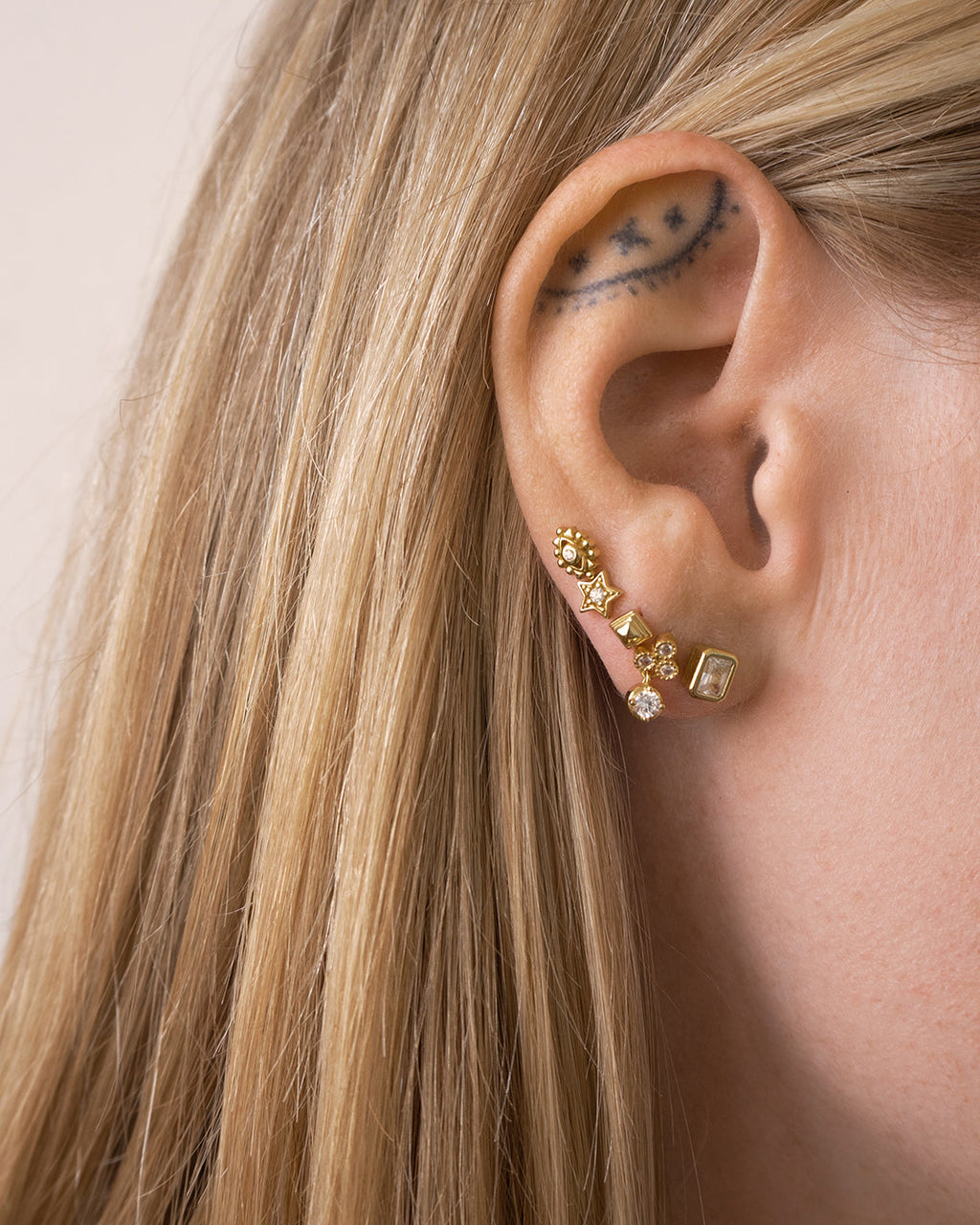 Metal Step Cut Pyramid Studs - Earrings — another angle